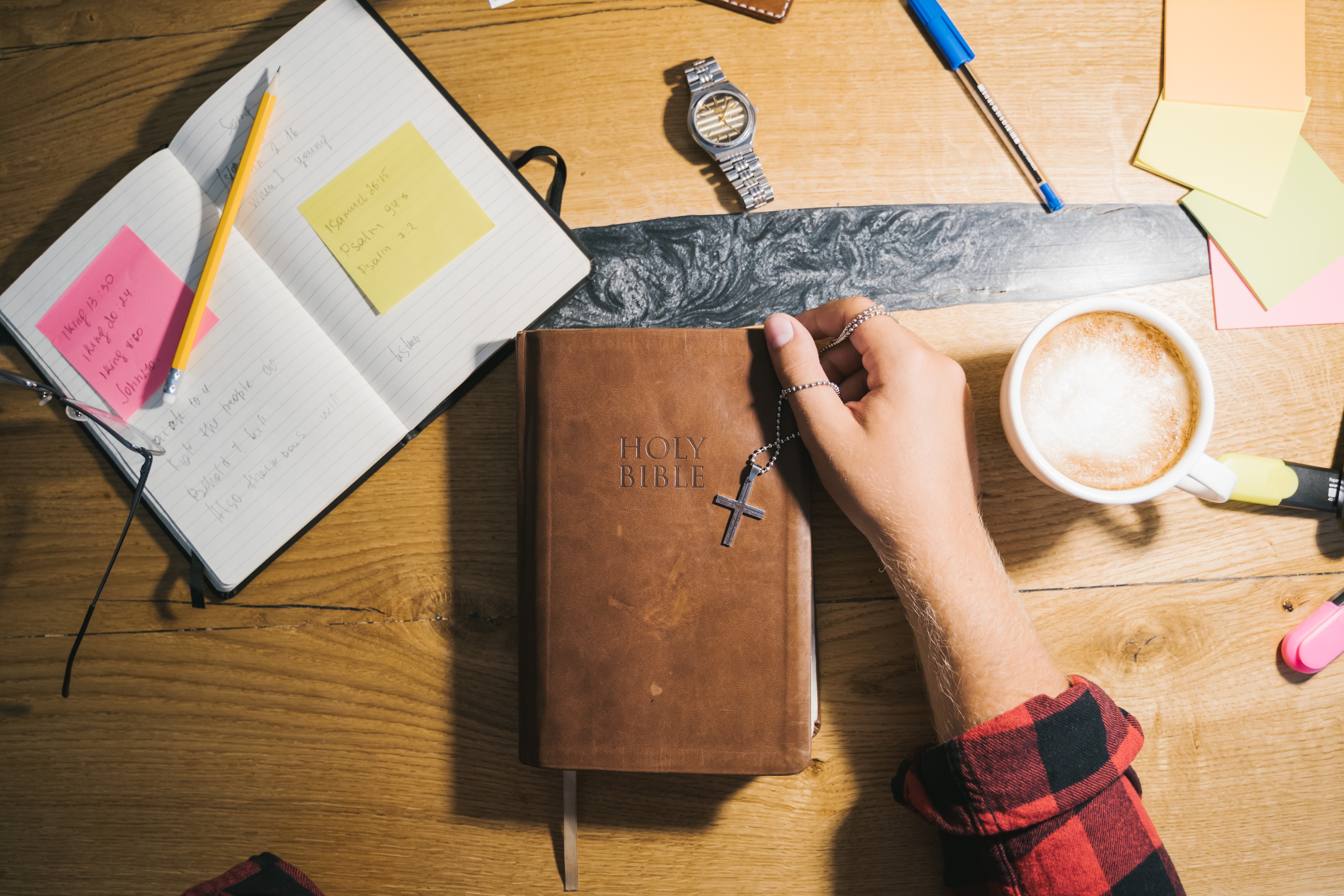 notebook, Bible, coffee cup, pencils